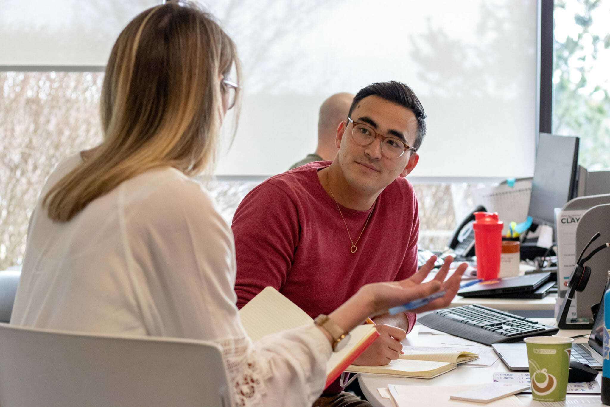 two employees discuss how to pass a behavioral test