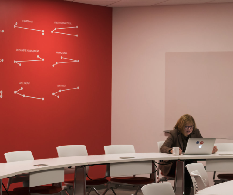 director analyzes people data at work