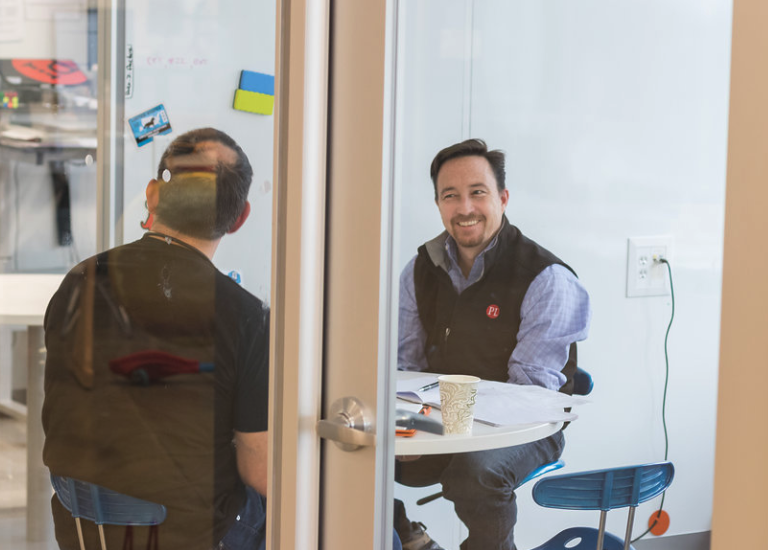 Two coworkers talking