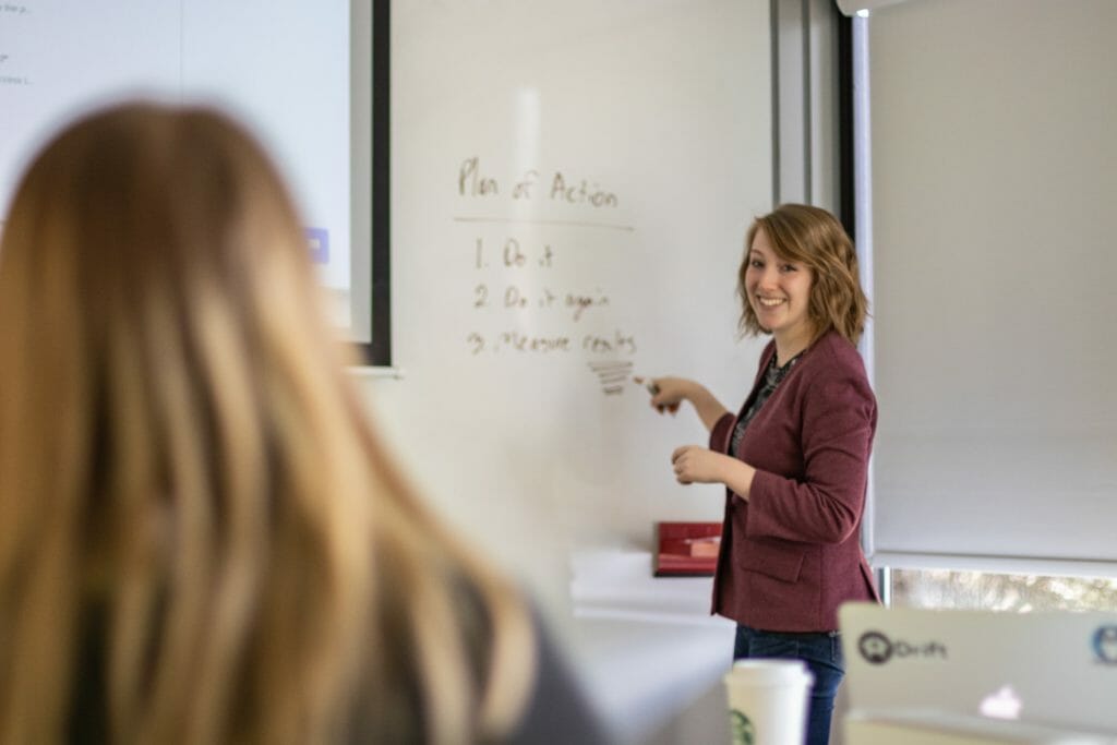 Woman smiling and presenting