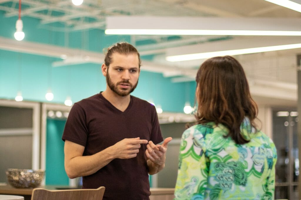 Two coworkers discussing