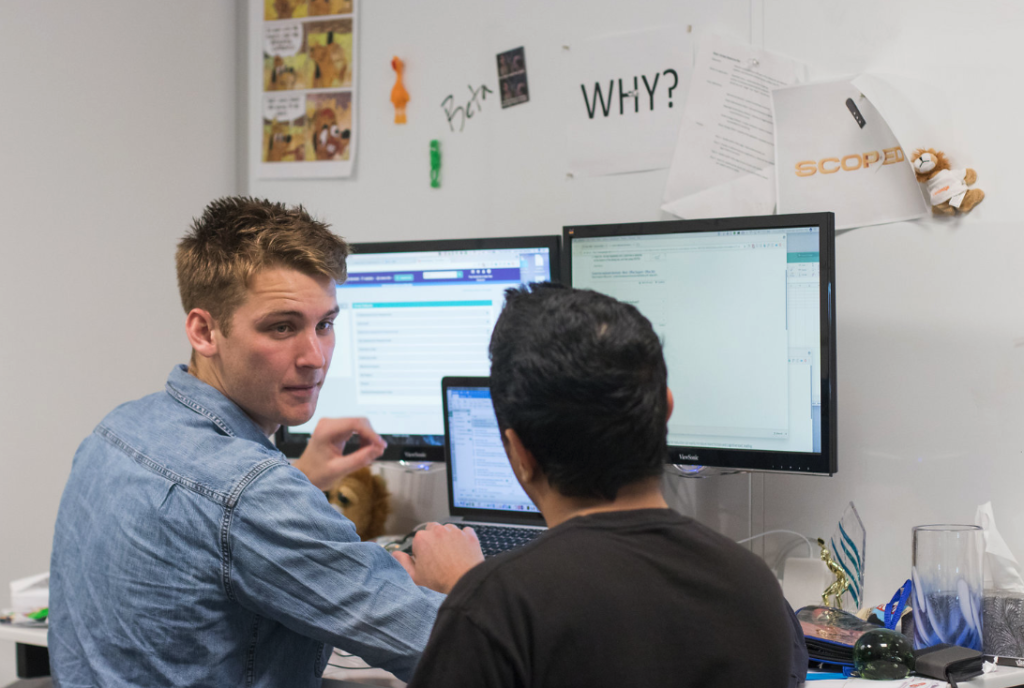 Two Coworkers looking at data