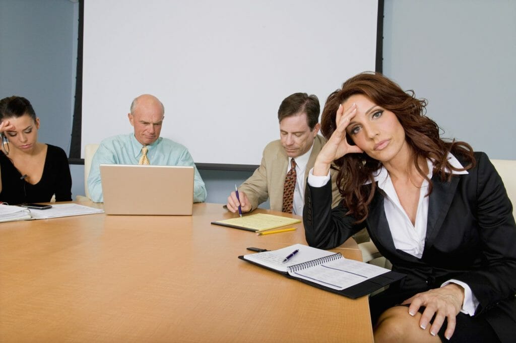 Woman bored in meeting