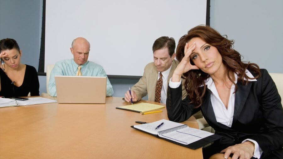 Woman bored in meeting