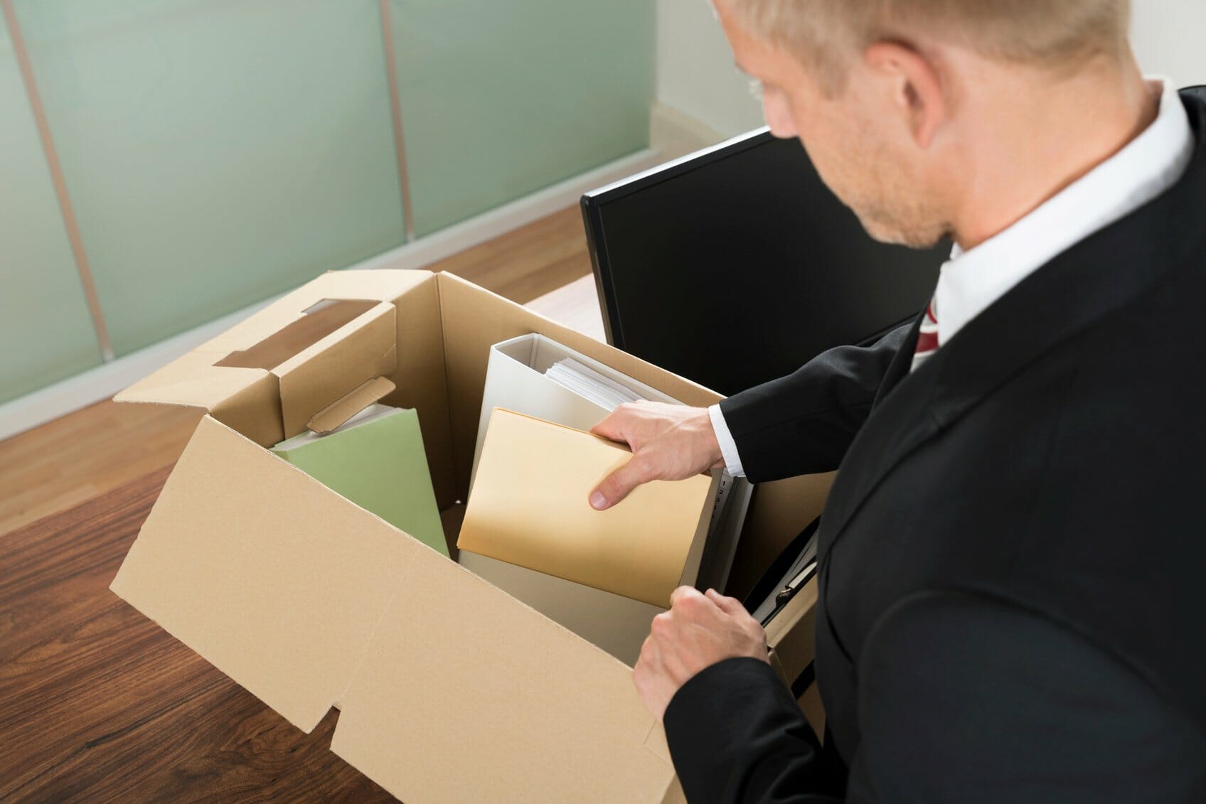 Employee packing up desk