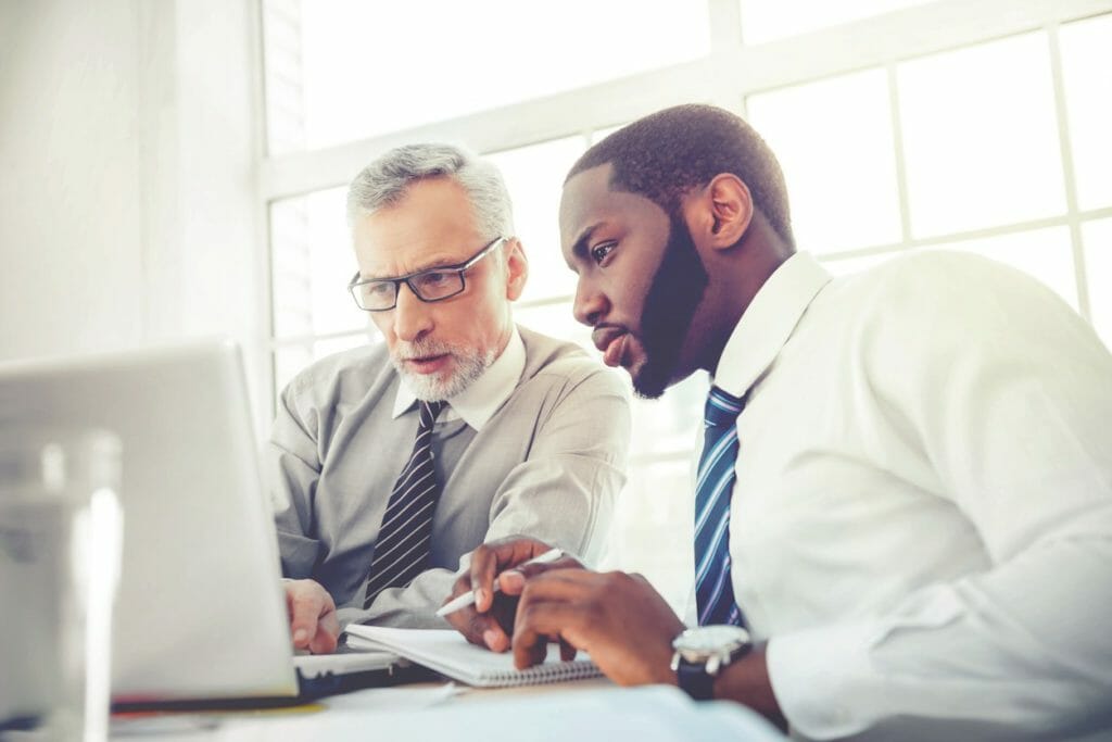 Men working on laptop