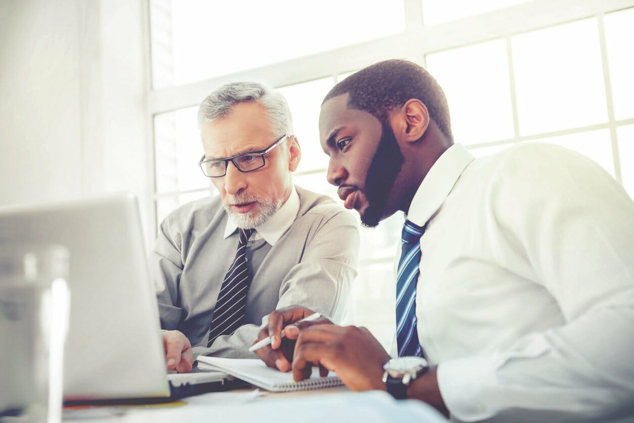 Men working on laptop