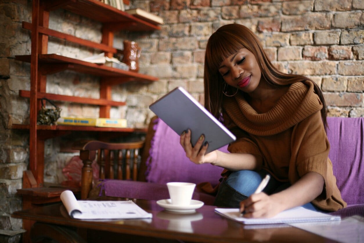 Woman working in cafe at remote job