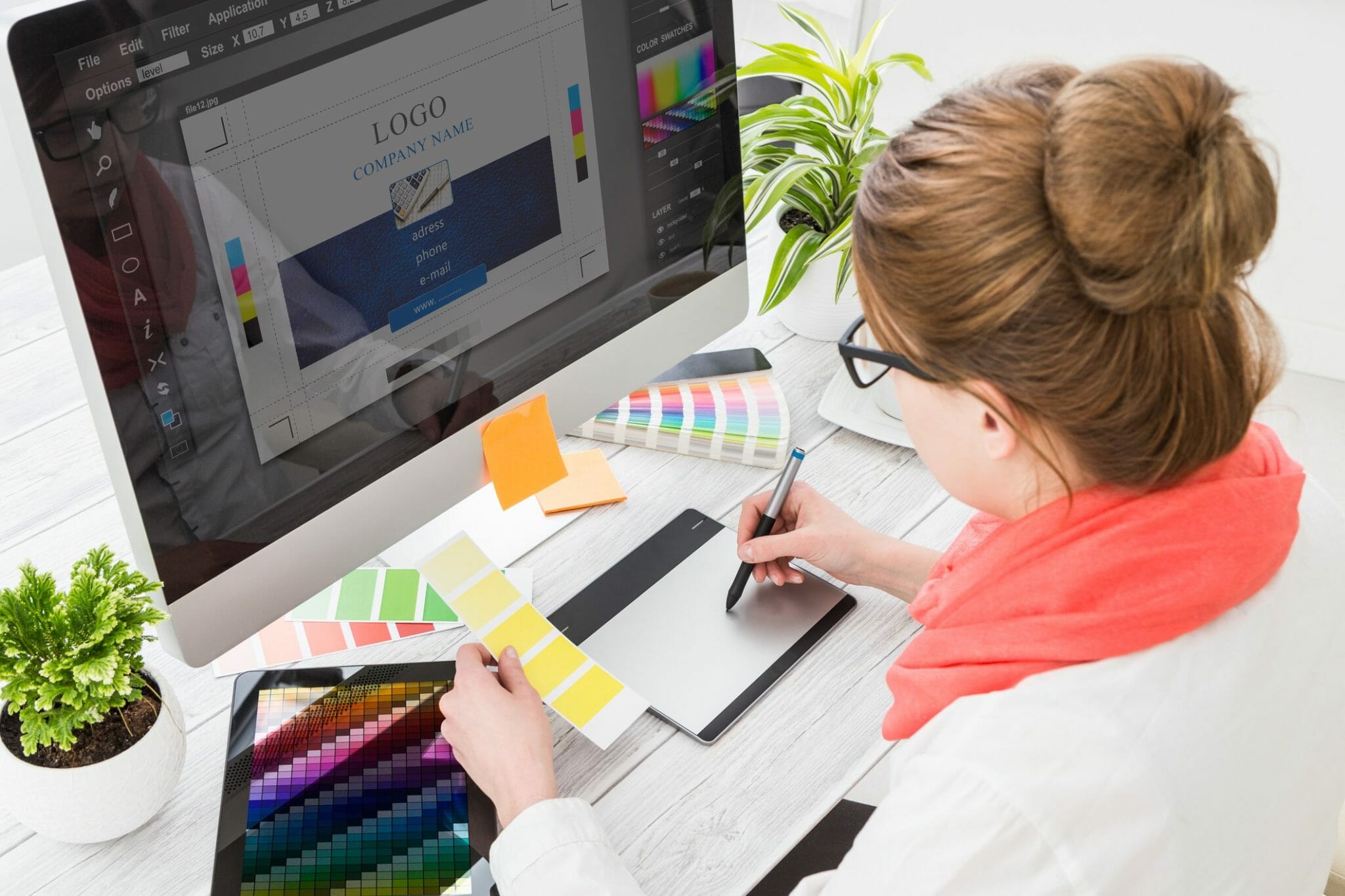 Employee creating logo on computer