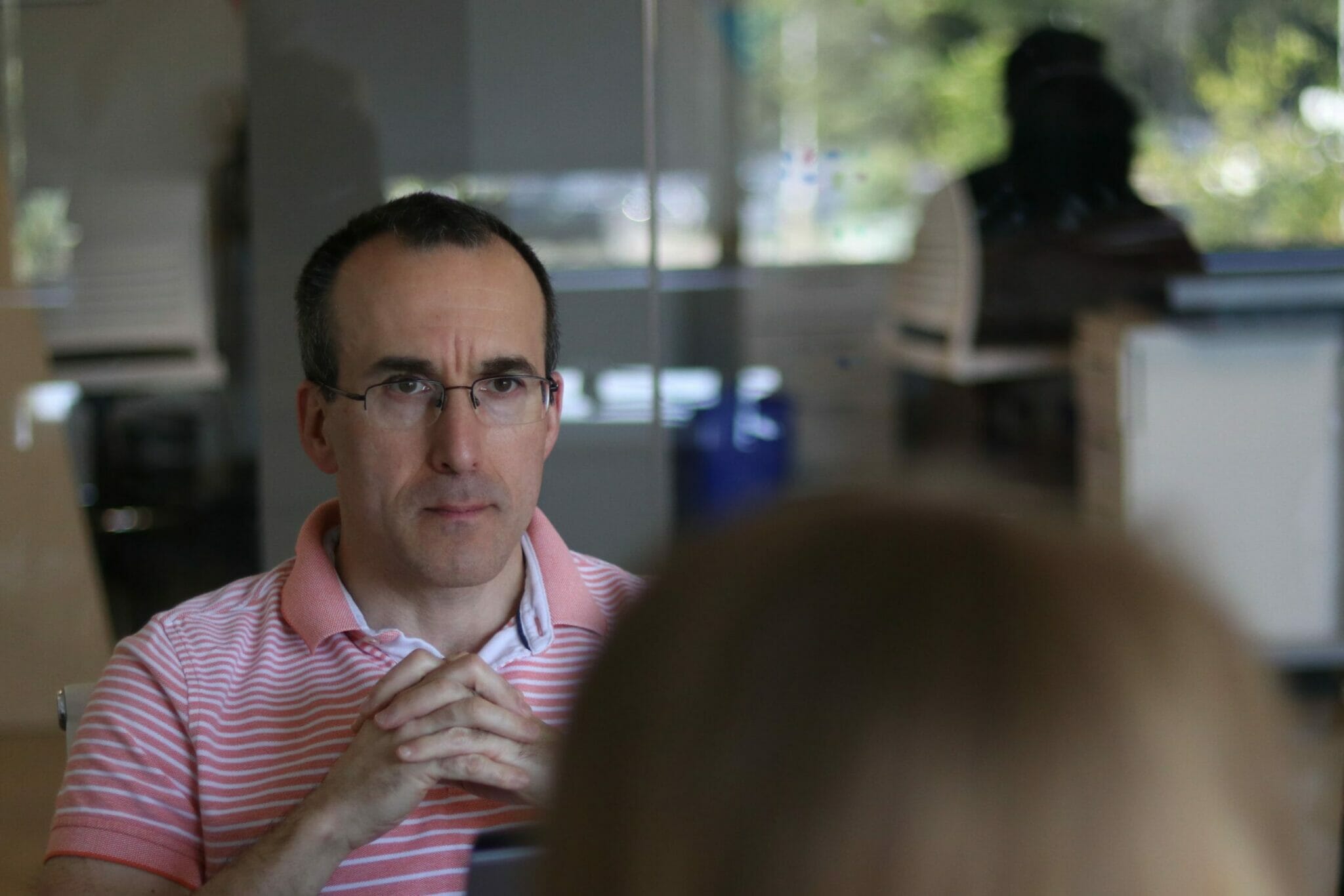 man listening in group