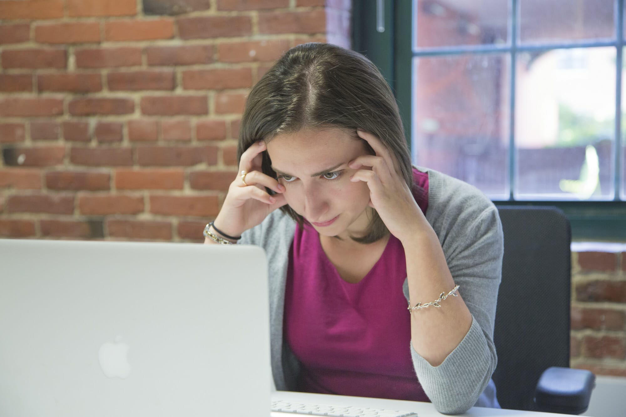 woman focusing on laptop