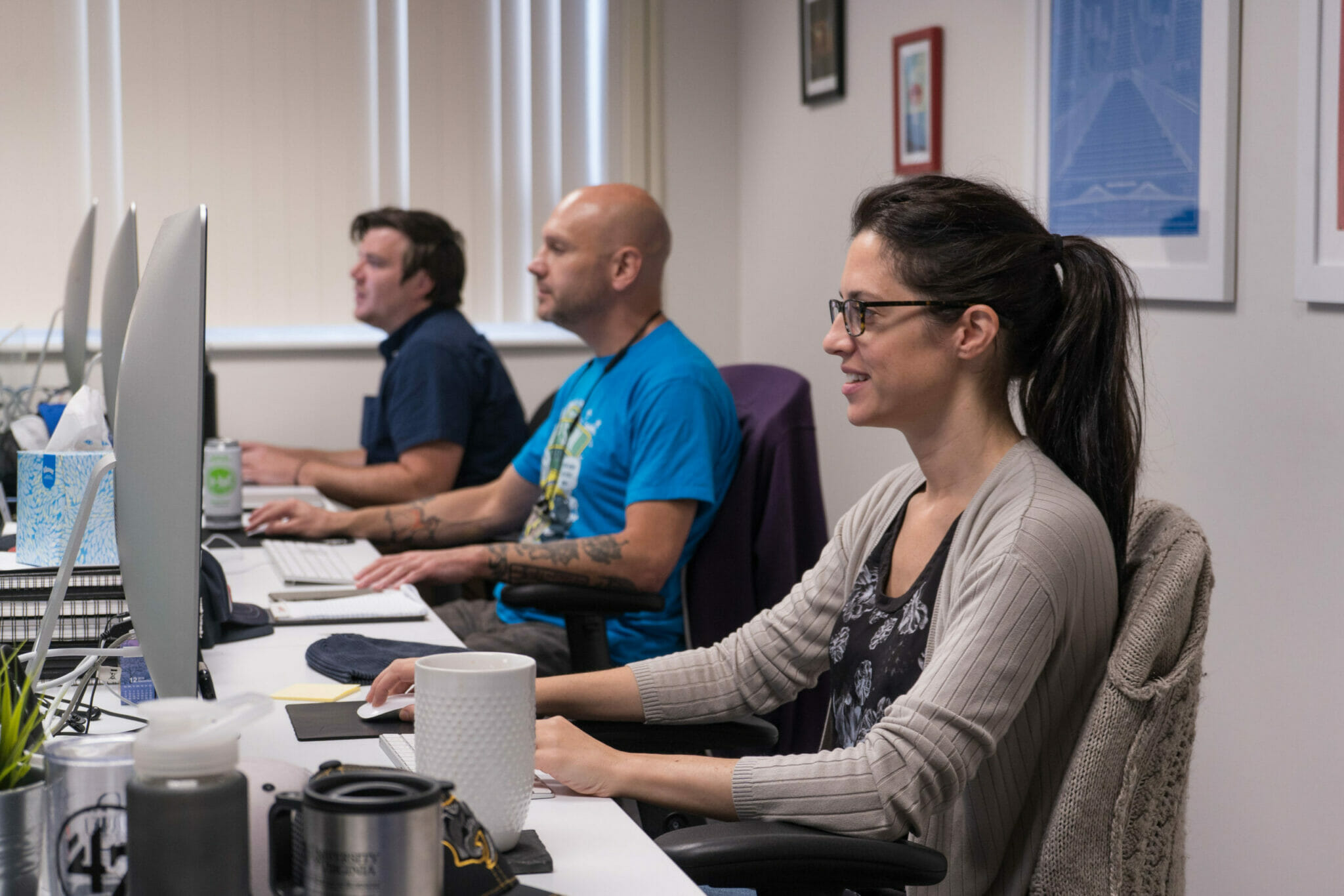 Happy engaged employees at desks