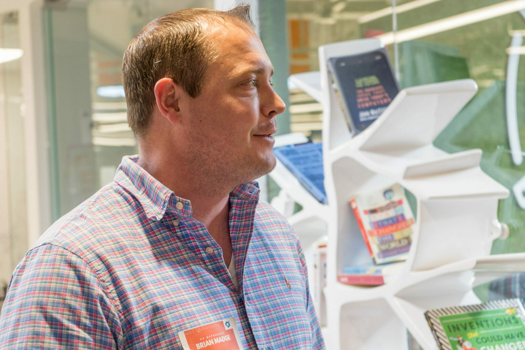 employee standing near book shelf