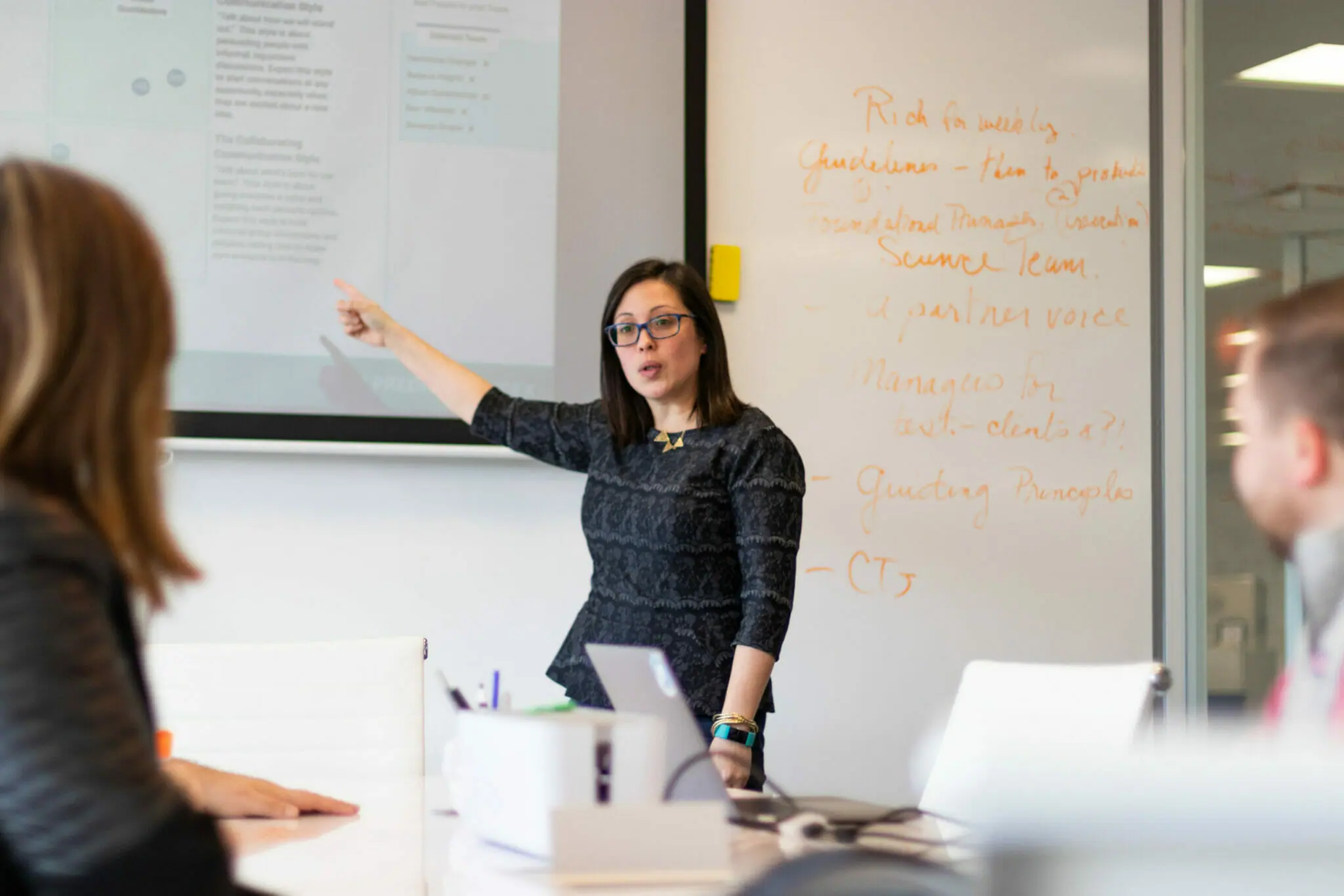 Business Woman Explain At The Huge Whiteboard Stock Photo, Picture