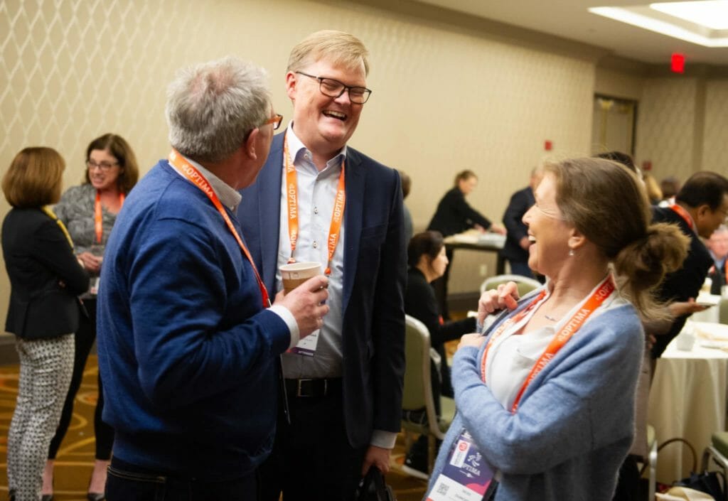 Consultants talking at the OPTIMA 2019 conference