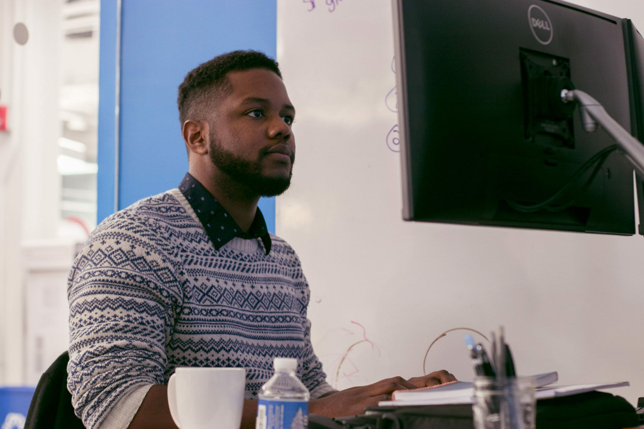 tech employee working at his desk