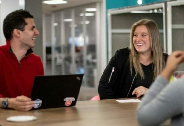 employees laughing in office